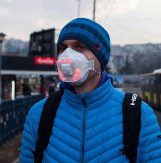 Man wears Airbeam LED mask. Source: Unmask My City